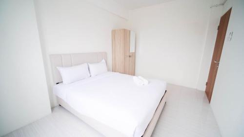 Surabaya Appartement | Best Choice 2BR at Puncak Dharmahusada Apartment Surabaya By Travelio