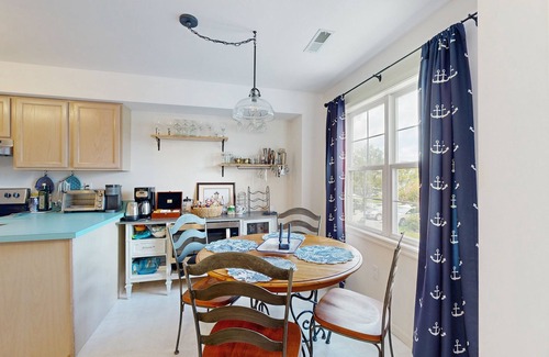 Ocean View Maison | Bethany Marina dog friendly bayfront townhouse w/pool, balcony, grill