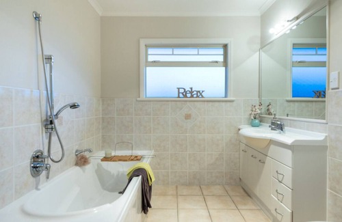 Papamoa Beach Maison | Better than a resort! Swimming pool, spa, pool-table. Walk to beach,shops,cafes.