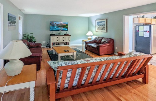 Piney Island Maison | Blue Heron, modern beach retreat with outdoor shower and screened porch