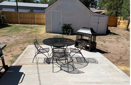 Woodward Maison | Blue house on 5th! Arcade room, fire pit, privacy fenced yard, and more!!