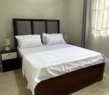 Msasani Maison | Blue wave loft master bedroom