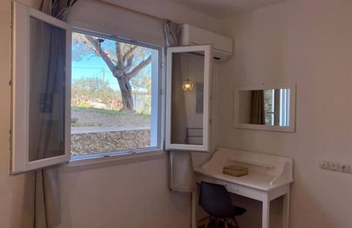 Agii Anargiri Cottage | Brachera’s Garden Apartment "Summer is a state of mind"