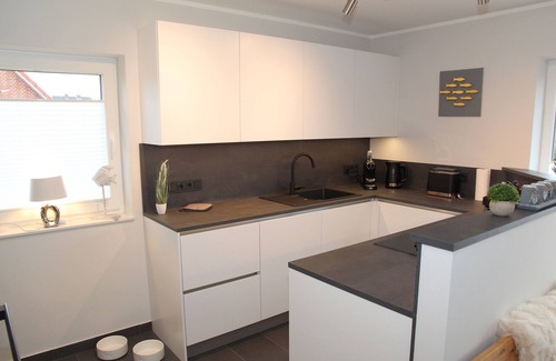 Eilsum Maison | Brand new 85sqm vacation home with dog permit directly on the water near Greetsiel!