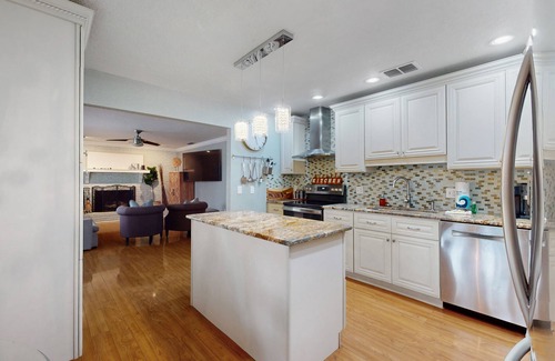 Spring Hill Maison | Bright & charming beach retreat with large lanai, firepit, & fireplace - dogs ok