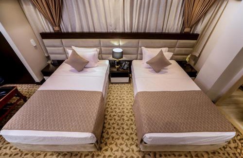 Al Duqqi Hôtel | Cairo Taj Hotels & Suites- Mohandessin