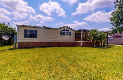 Astor Maison | Canal-Front Home with Private Covered Boat Dock & Waterfront Screened Porch