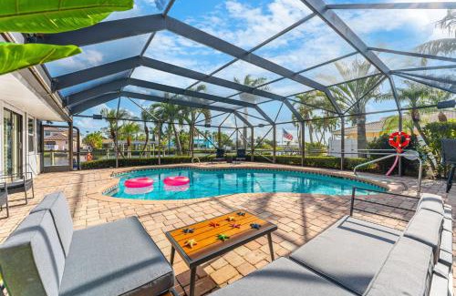 Cocoa Isles Villa | Casa De Olas - Waterfront Luxe Home - Heated Pool - Boat Lift - Minutes to Beach