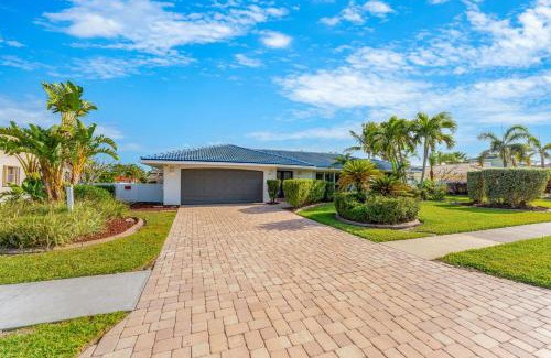 Cocoa Isles Villa | Casa De Olas - Waterfront Luxe Home - Heated Pool - Boat Lift - Minutes to Beach