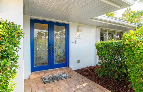 Cocoa Isles Villa | Casa De Olas - Waterfront Luxe Home - Heated Pool - Boat Lift - Minutes to Beach