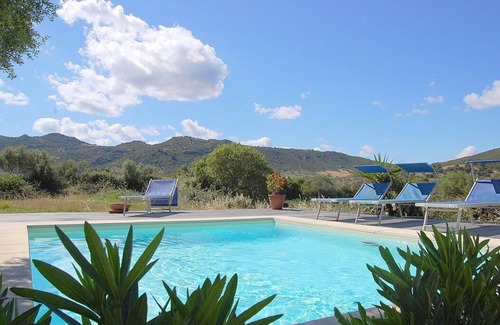 Loiri Porto San Paolo Maison | Casa Perella E: A graceful cottage surrounded by the greenery, with Free WI-FI.