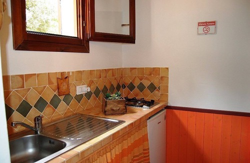 Loiri Porto San Paolo Maison | Casa Perella F: A graceful cottage surrounded by the greenery, with Free WI-FI.