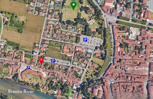 Bassano del Grappa Appartement | Casa Tonde, a modern attic with exposed beams.