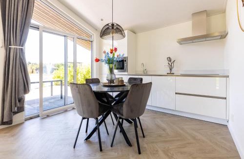 Municipality of Veldhoven Chalet De Ski | Chalet by Pond in Holiday Park