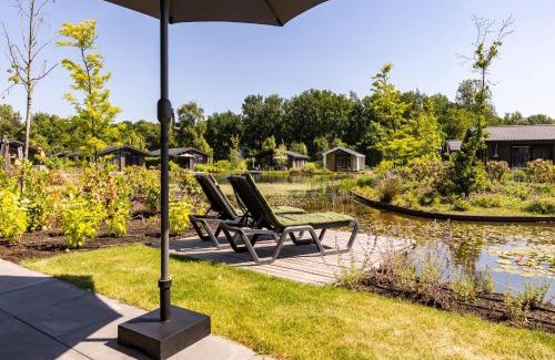 Municipality of Veldhoven Chalet De Ski | Chalet by Pond in Holiday Park