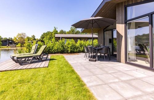 Municipality of Veldhoven Chalet De Ski | Chalet by Pond in Holiday Park