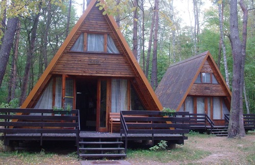 Sierakow Chalet De Ski | Chalet dans un parc de vacances dans une zone boisée au bord du lac et près d'une plage.