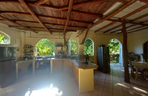 Buenos Aires Chalet De Ski | Chalet with jungle view deck on a river in lively Santa Teresa's surf town