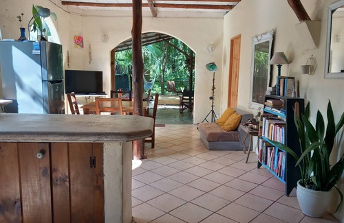 Buenos Aires Chalet De Ski | Chalet with jungle view deck on a river in lively Santa Teresa's surf town