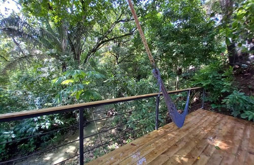 Buenos Aires Chalet De Ski | Chalet with jungle view deck on a river in lively Santa Teresa's surf town