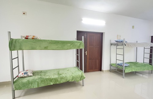 Quilandi Maison | Charming 1-bedroom house in Koyilandy with WiFi access