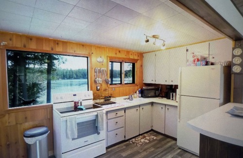 Elcho Cottage | Charming 2-bedroom cottage lake property with two piers, kayaks and fire pit!