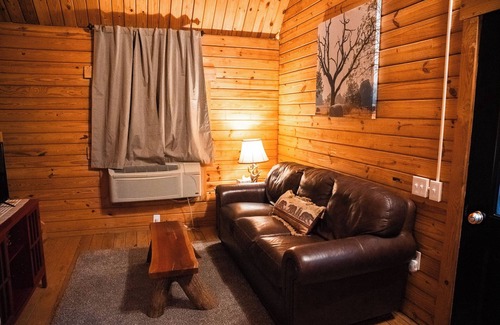 Hattieville Cabine | Charming cabin with loft, porch swing, AC, and WiFi on 295-acre peaceful retreat