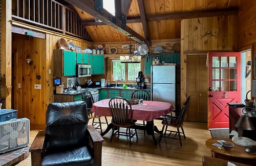 Wiscasset Maison | Charming riverfront home with cozy interiors, dock, and scenic deck views