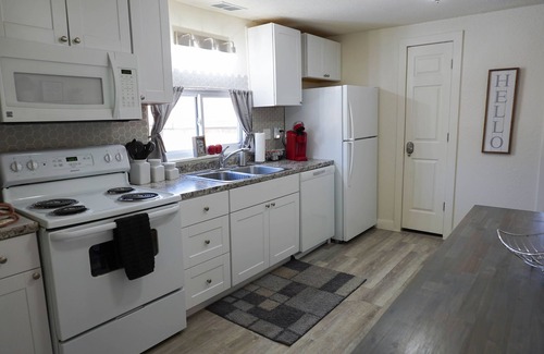 Berkley Maison | Check this house out!! It has a Hot Tub, Gas Fire Pit and Corn Hole!