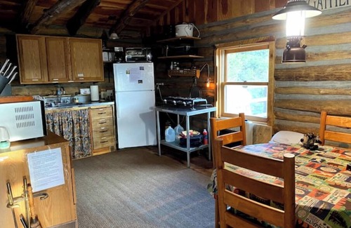 Gulnare Maison | CJs Ranch RV and Tent spots with Log Cabin