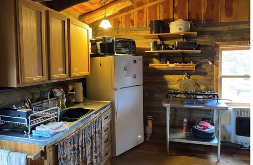 Gulnare Maison | CJs Ranch RV and Tent spots with Log Cabin