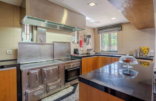 Paredes Maison | Classic Villa w/ Gym and Pool Access by HostWise