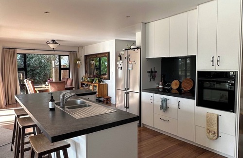 Papamoa Beach Maison | Coastal family home, 5 minutes walk to beach, hot tub, fully accessible
