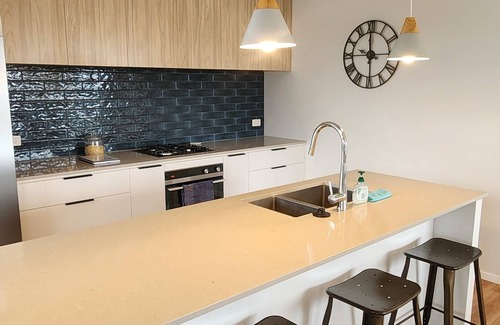 Papamoa Beach Maison | Coastal spacious 4-bedroom house close to beach with spa.