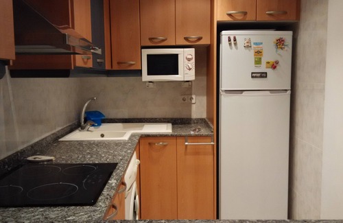 Comarruga Appartement | Appartement confortable, Wi-Fi A / C et piscine.