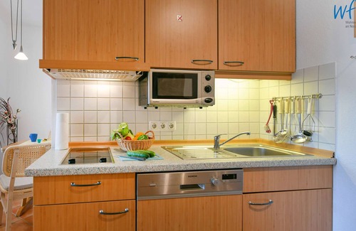 Neuensien Appartement | Comfortable vacation apartment with lake view and conservatory in the Seedorf vacation park