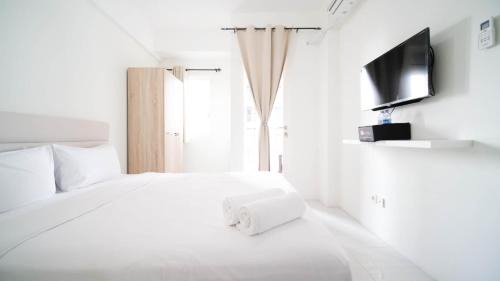 Surabaya Appartement | Compact and Tidy Studio at Puncak Dharmahusada Apartment By Travelio