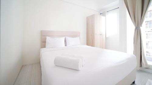 Surabaya Appartement | Compact and Tidy Studio at Puncak Dharmahusada Apartment By Travelio