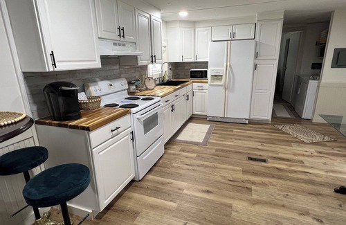 Moultrie Maison | Completely renovated mobile home sitting own a pond.