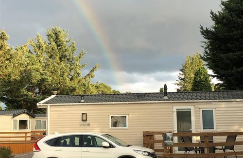 Boat of Garten Maison | Cosy chalet - Poppy Lodge in Boat of Garten, Dog Friendly, free wifi!