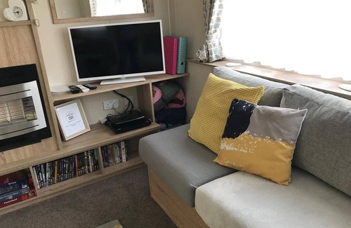Boat of Garten Maison | Cosy chalet - Poppy Lodge in Boat of Garten, Dog Friendly, free wifi!