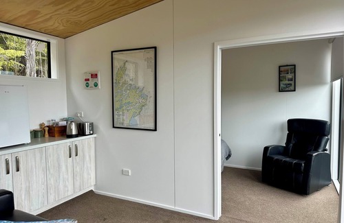 Moetapu Bay Cabine | A cosy two bedroom off-grid cabin, the perfect place to rest, relax & recharge.