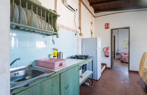 Fuenteheridos Maison | Maison de campagne 'Nueva' avec vue sur les montagnes, piscine partagée et climatisation