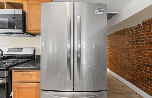 Columbia Heights Maison | Cozy 2 bedroom/1.5 bathroom English basement townhome. Spacious, safe, and family-friendly with open kitchen, dining area, and crib. Easy access to shops, restaurants, and DC attractions.