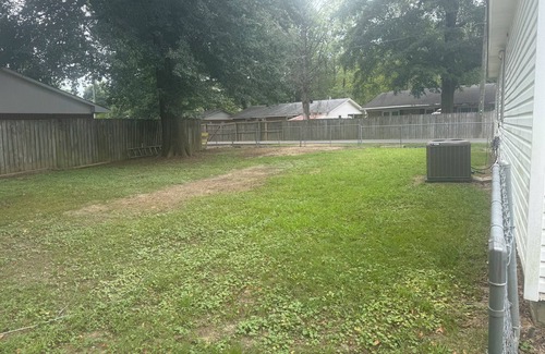 Piggott Maison | Cozy 3-Bedroom Cottage with Carport & Shaded Yard. Nestled under a big tree.