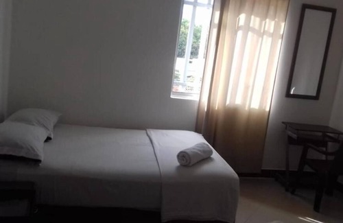 Florida Nueva Hôtel | Cozy bedroom in charming Medellín with WiFi