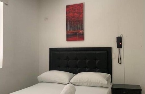 Florida Nueva Hôtel | Cozy bedroom in charming Medellín with WiFi