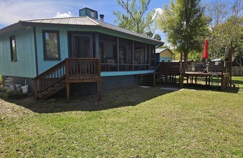 Astor Maison | Cozy canal front house with its own boat ramp and dock. Amazing waterfront view.