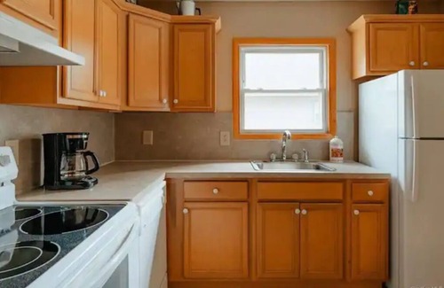 Swan Lake Cottage | Cozy lakeside cottage with modern furniture on a quiet street.