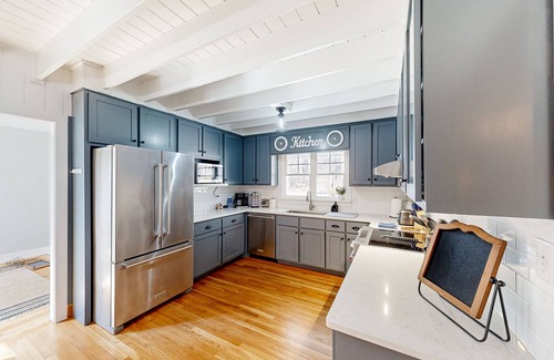 Forsyth Maison | Creekside home with firepit, yard games, deck, wood stove, & W/D
